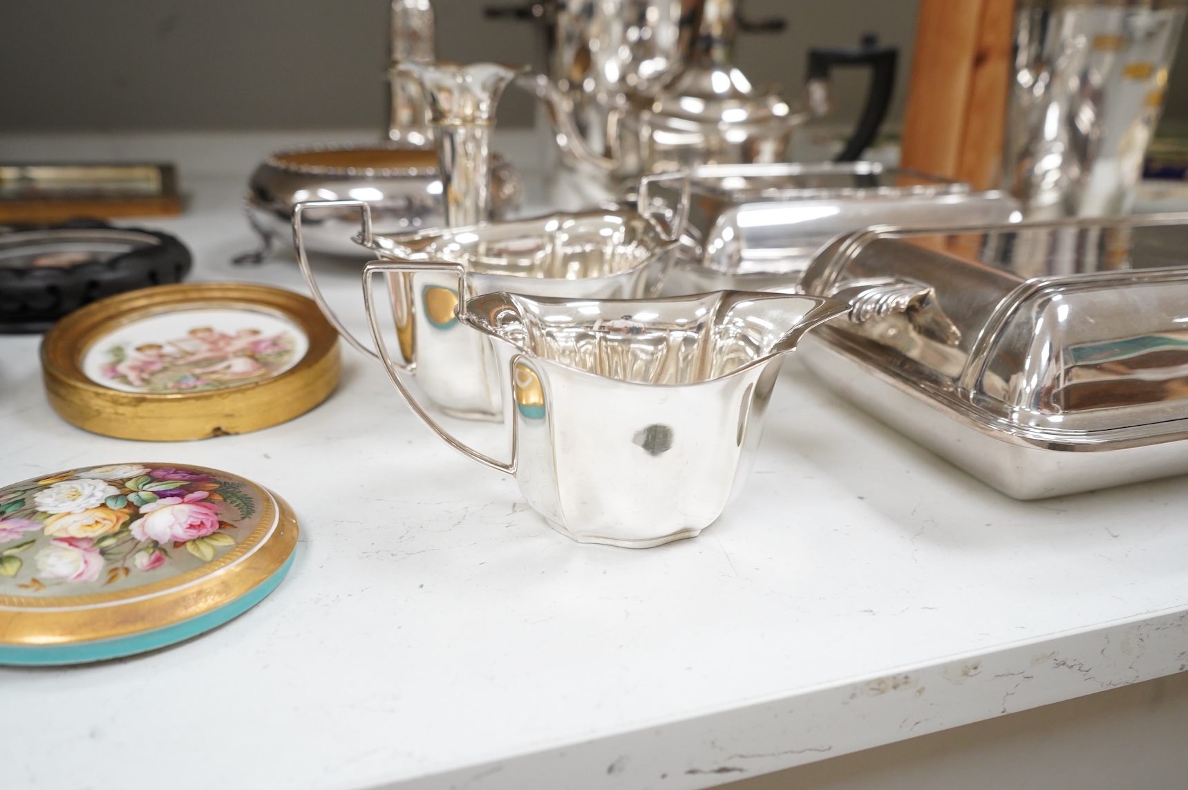 A collection of plated wares to include a vintage cocktail shaker with recipes, wine cooler and two plated entrée dishes including Art deco, largest 29cm wide
